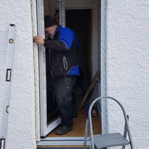 MatesRates installer performing door installation in aberdeen, scotland, a draught proofing installation